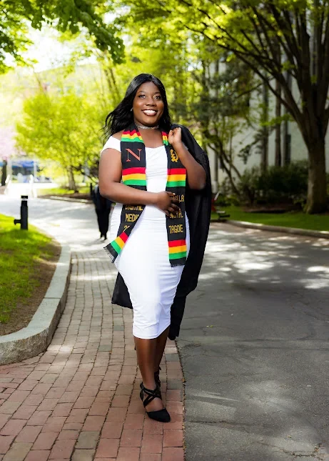 Portrait of Priscilla Tagoe outdoors in graduation regalia